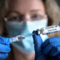 Covid-19,Vaccine,In,Researcher,Hands,,Female,Doctor,Holds,Syringe,And