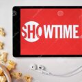 showtime-logo-screen-tablet-laying-white-table-sprinkled-popcorn-apple-earphones-near-showing-app-august-san-194612504